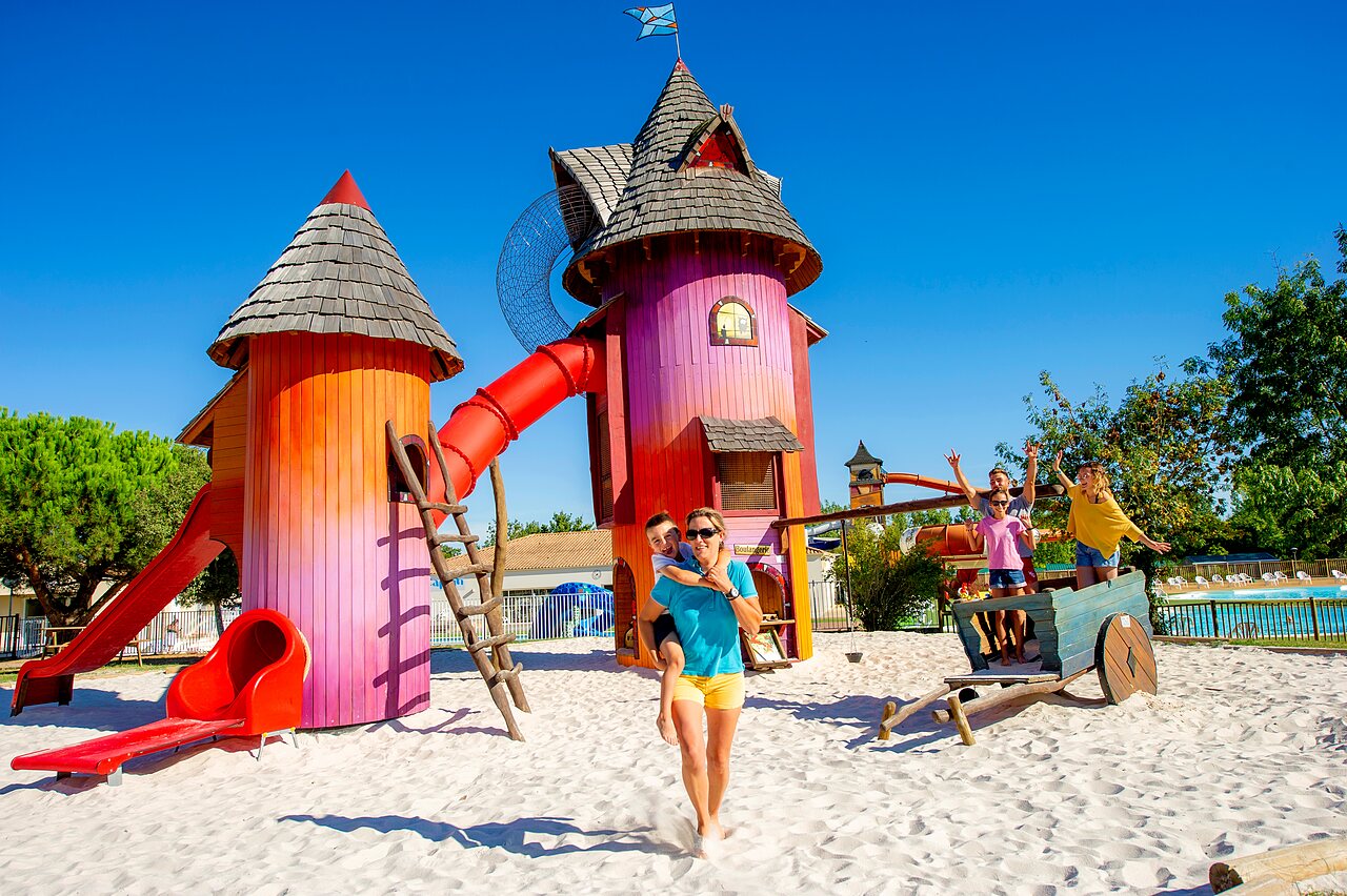 Colorful themed playground, slides, family at CAPFUN Forges campsite in Avrille (85).