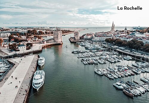 Old Port of La Rochelle with historic towers, a must-visit place.