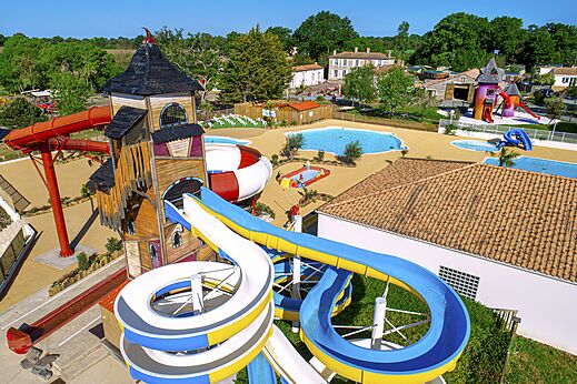 Giant water slides and pools at CAPFUN Forges campsite in Avrille (85).