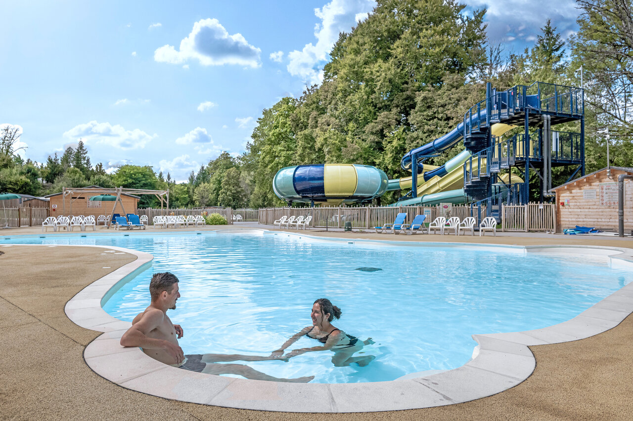 Outdoor swimming pool, water slides at CLICOCHIC Forge Sainte Marie campsite in Thonnance-les-Moulins.
