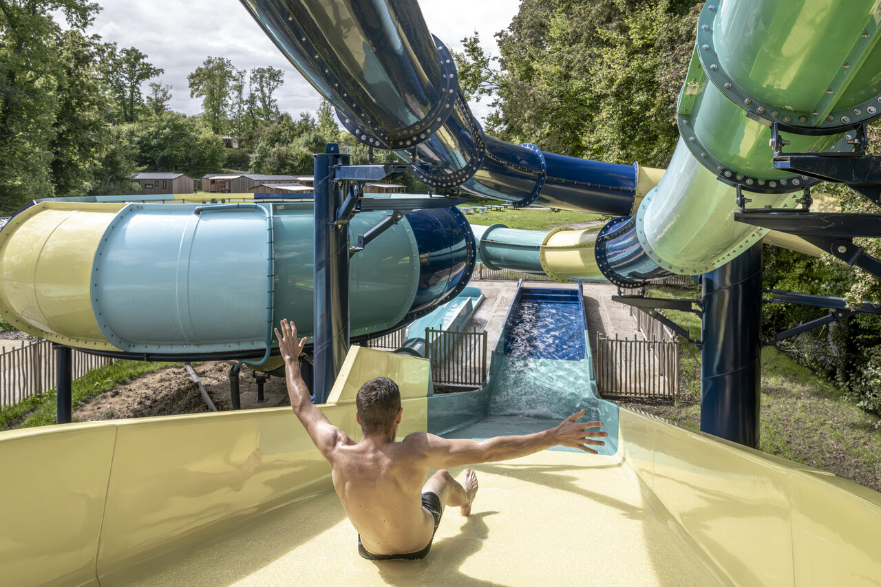 Water slide, man at CLICOCHIC Forge Sainte Marie Thonnance-les-Moulins (52).