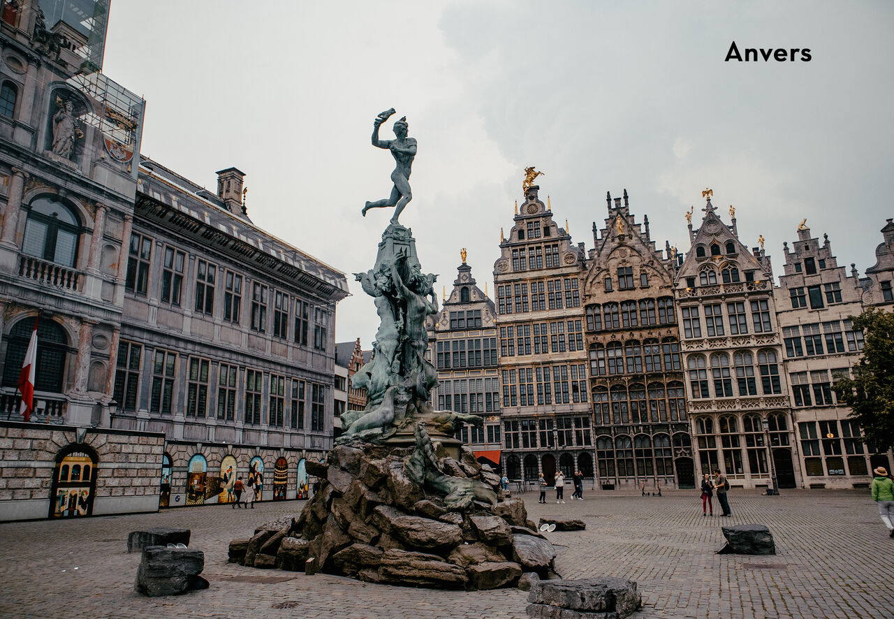 Brabo statue and historic houses on the Grote Markt in Antwerp, Belgium.