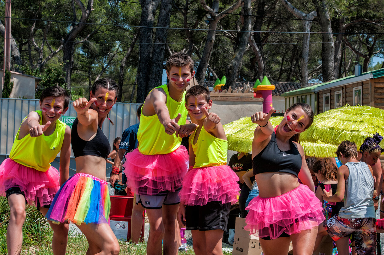 Group of entertainers and campers dressed up with face paint, at CAPFUN Fort Falabraque campsite in Seltz (67).