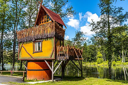 Colorful treehouse near a lake at CAPFUN Fredland campsite in Tournan en Brie.