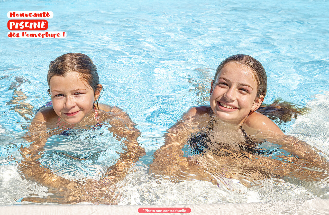 Two smiling girls in the new pool at CAPFUN Le Fr�jus, Fr�jus (83).
