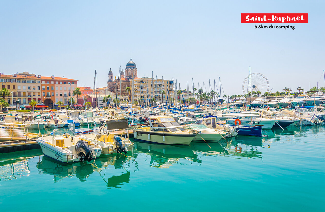 Saint-Rapha�l marina with boats, church, and Ferris wheel, French Riviera.