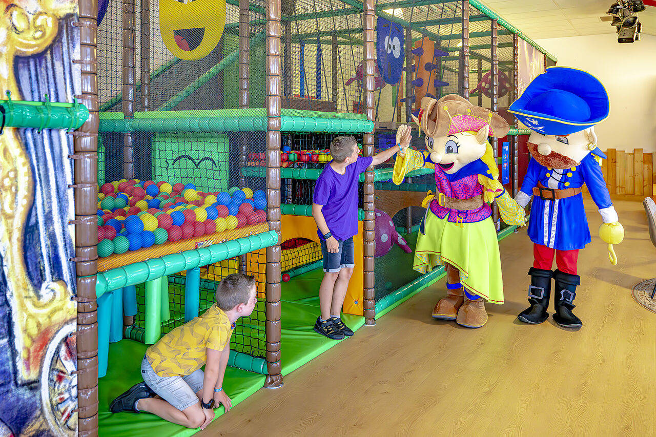 Indoor play area with ball pit and mascots at CAPFUN De Fruithof campsite in Klijndijk