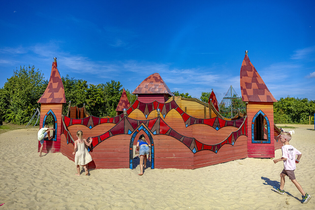 Wooden castle playground for children at CAPFUN De Fruithof in Klijndijk.