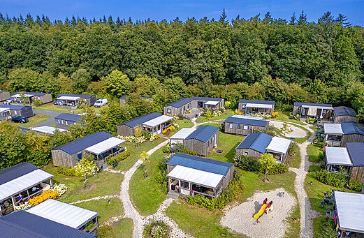 Modern mobile homes with terraces, aerial view at CAPFUN De Fruithof campsite in Klijndijk.