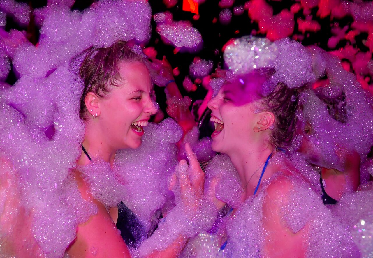 Foam party, laughing youth at CAPFUN Fumades campsite in ALLEGRE-LES-FUMADES (30).