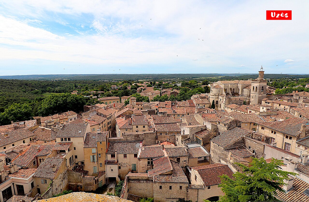 Historic city of Uz�s, tiled roofs and bishop's tower, a must-visit.