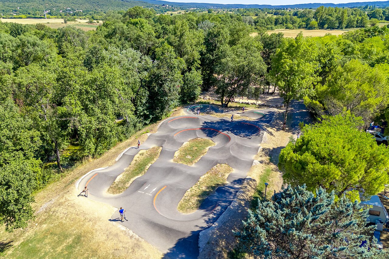 Modern pump track for bikes and scooters at CAPFUN Fumades campsite in ALLEGRE-LES-FUMADES (30).