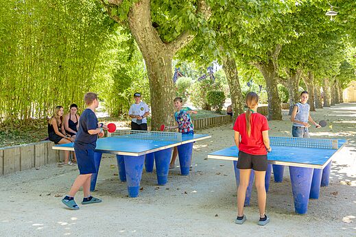 Outdoor table tennis game at CAPFUN Fumades campsite in ALLEGRE-LES-FUMADES (30).