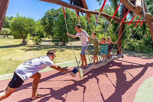 Play structure with rope bridge for children and adult at CAPFUN Fumades campsite in ALLEGRE-LES-FUMADES (30).