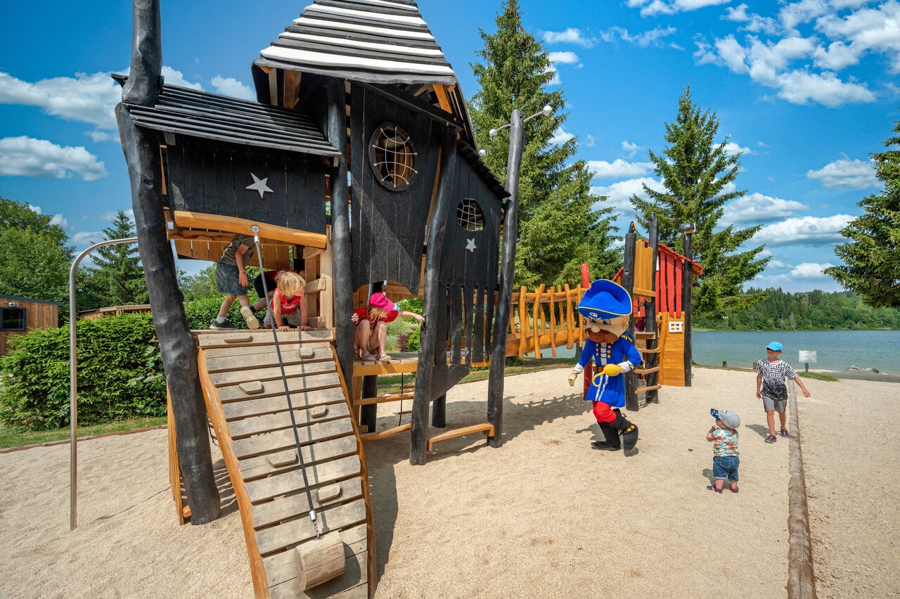 Wooden castle playground, children, mascot, lake at CAPFUN Fuvettes campsite in Malbuisson (25).