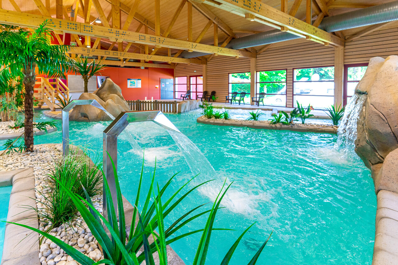 Heated indoor swimming pool with water jets at CAPFUN Fuvettes campsite in Malbuisson (25).