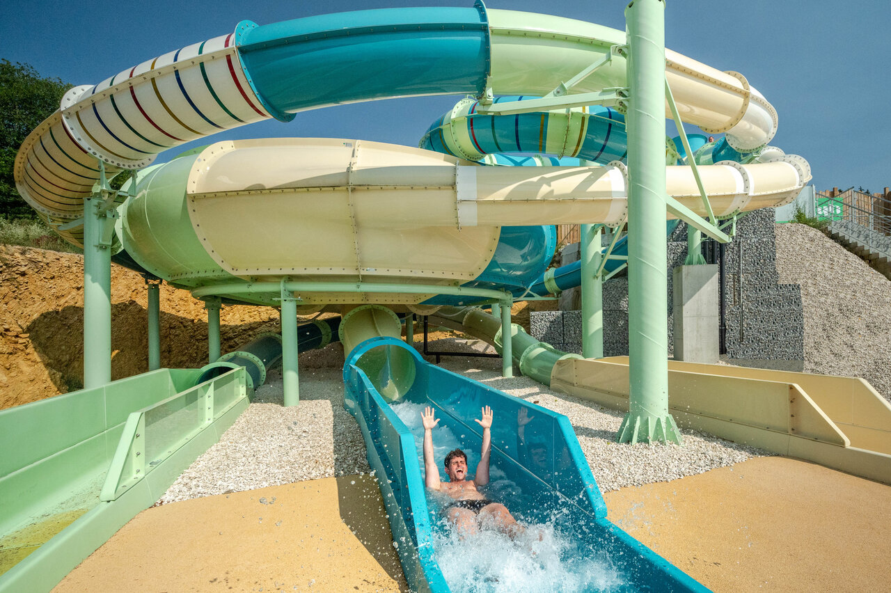 Man on giant water slide, CAPFUN Fuvettes campsite in Malbuisson (25).