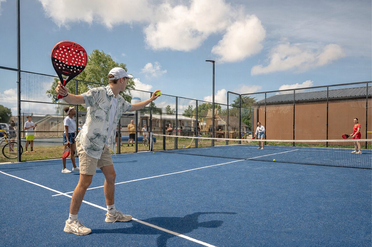 Padel players on blue court at CAPFUN Golf, SAINT JEAN DE LA RIVIERE (50).