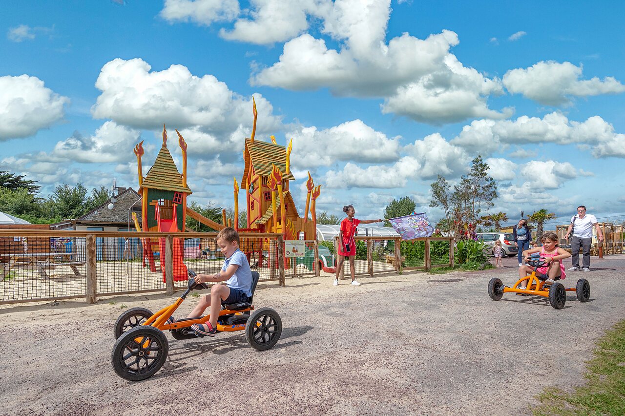 Pedal karts, playground at CAPFUN Golf campsite in SAINT JEAN DE LA RIVIERE (50).