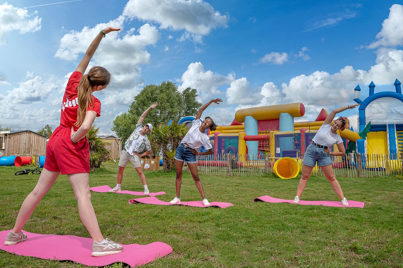 Fitness session with inflatables at CAPFUN Golf campsite in SAINT JEAN DE LA RIVIERE (50).