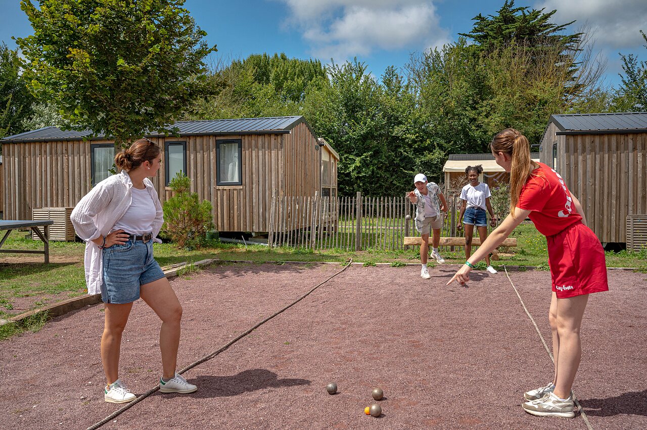 Petanque and mobile homes at CAPFUN Golf, SAINT JEAN DE LA RIVIERE (50).