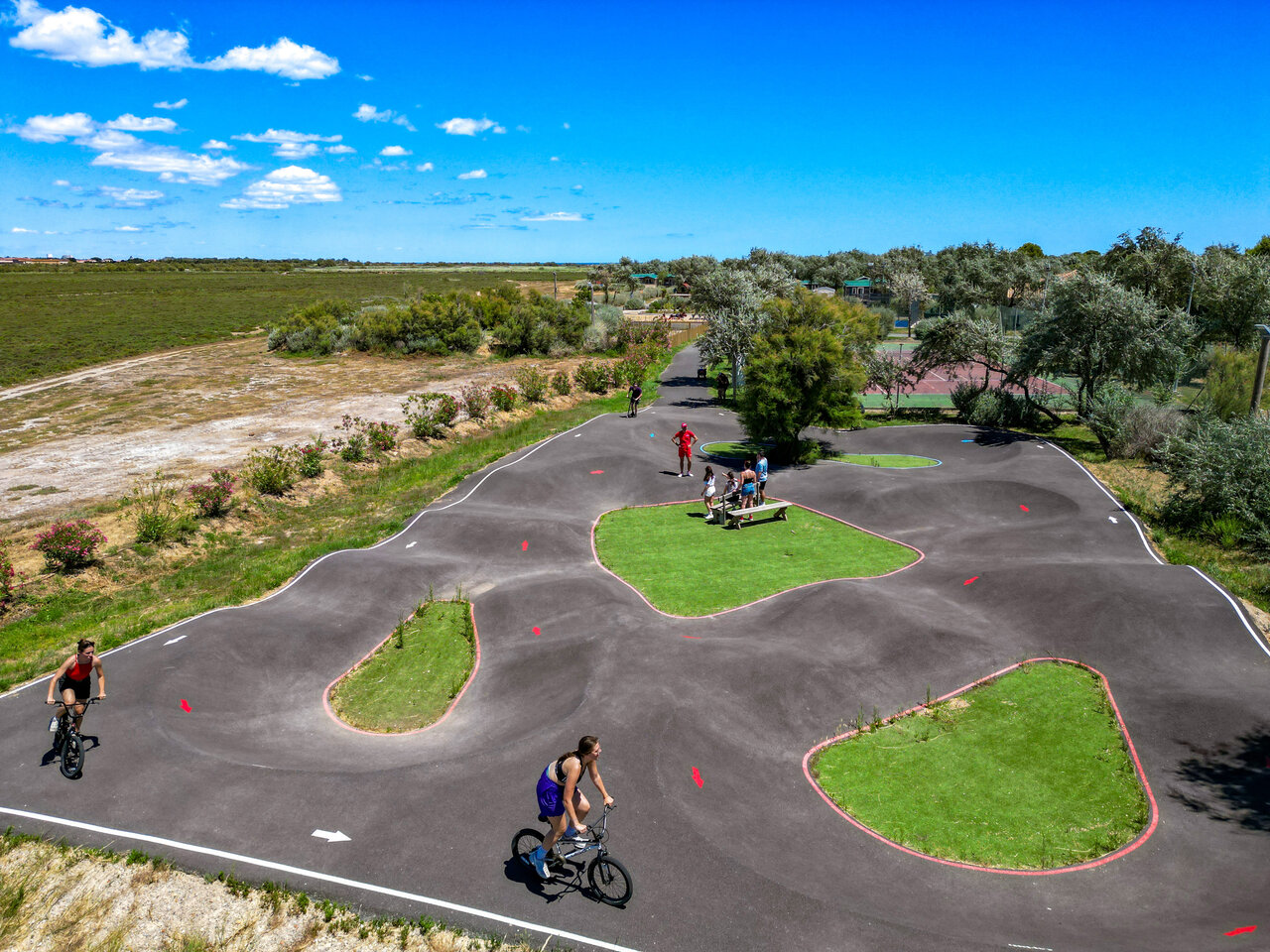 Pump track and cyclists at CAPFUN Grande Cosse in Saint Pierre la Mer (11).