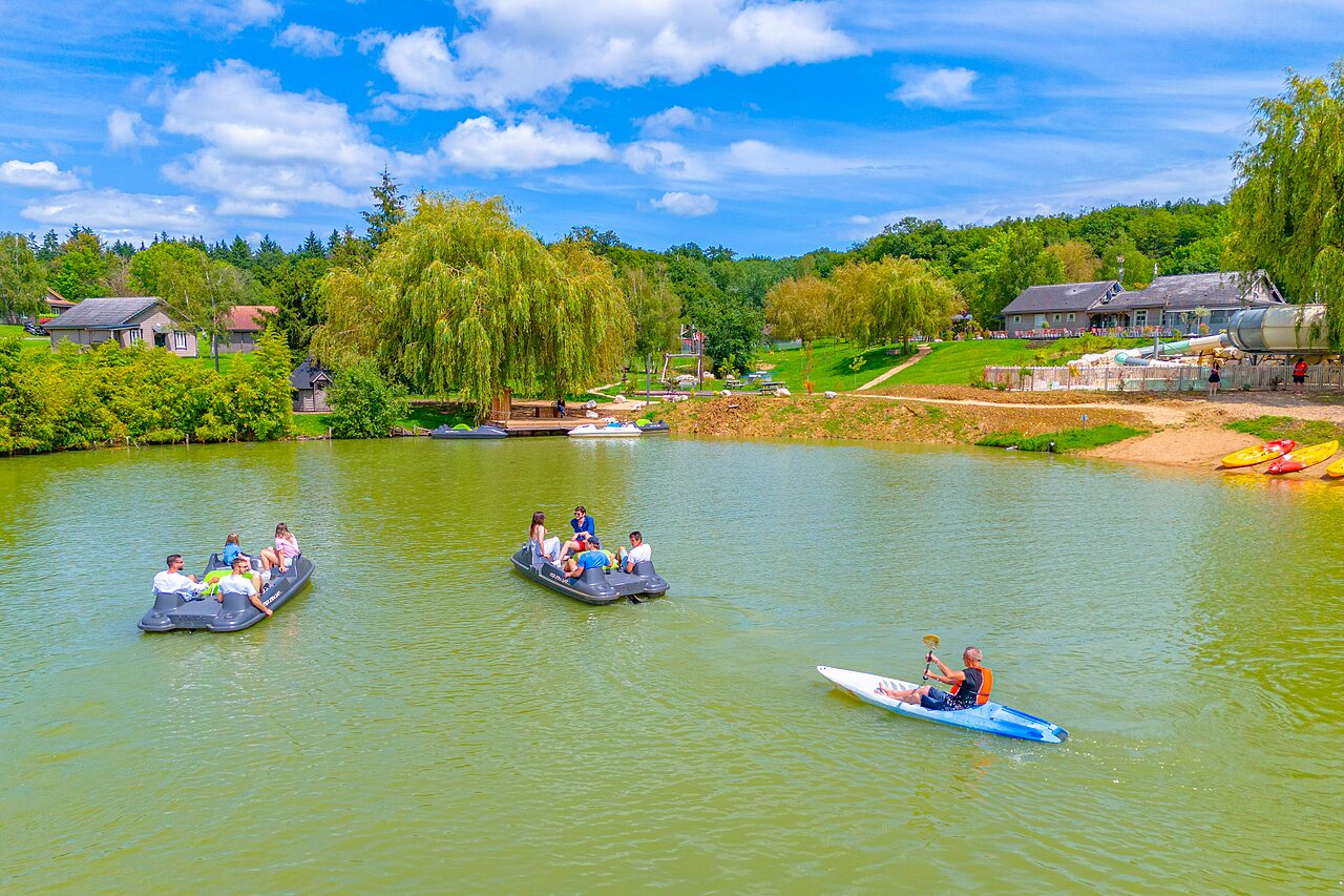Pedal boats, kayak and water activities on the lake at CAPFUN Grand Cerf campsite.
