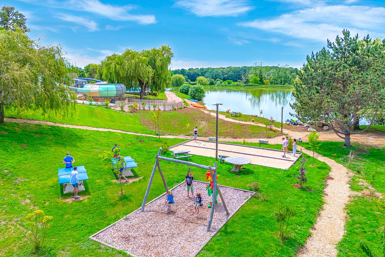 Playground, p�tanque, table tennis, waterslide at CAPFUN Grand Cerf campsite.