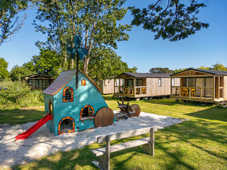 Playhouse slide and Mobile Homes at CAPFUN Grand Large in FOUESNANT (29).