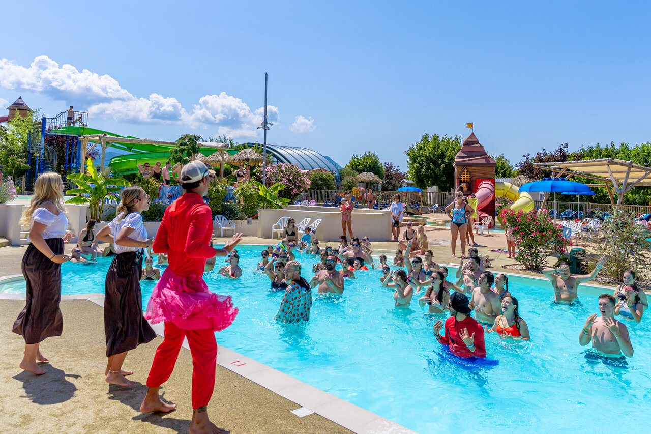 Water animation and slides in pool at CAPFUN Grand Lierne campsite CHATEAUDOUBLE.