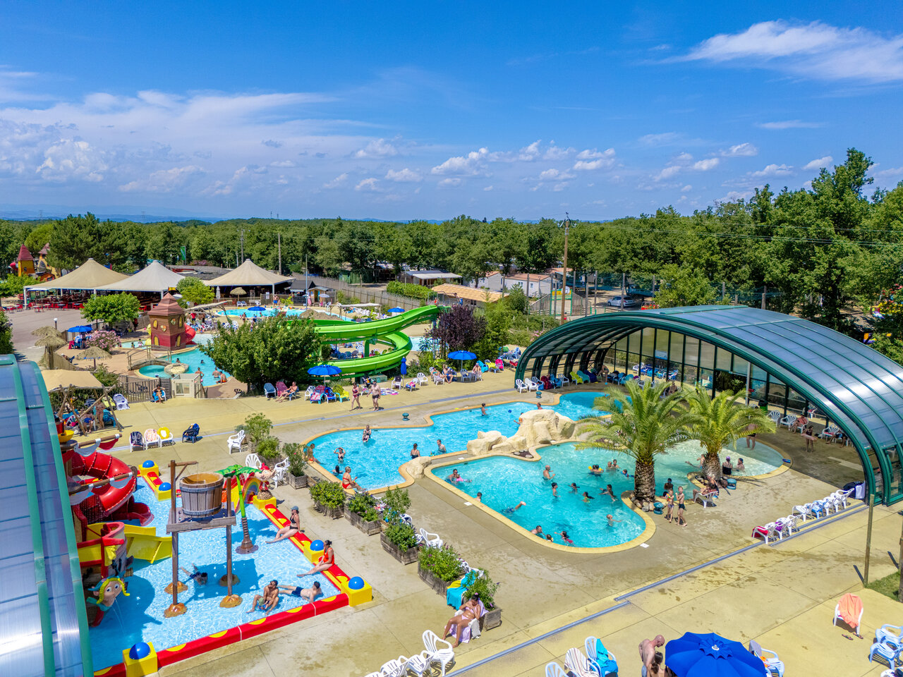 Pools, water slides and covered pool at CAPFUN Grand Lierne campsite in CHATEAUDOUBLE (26).