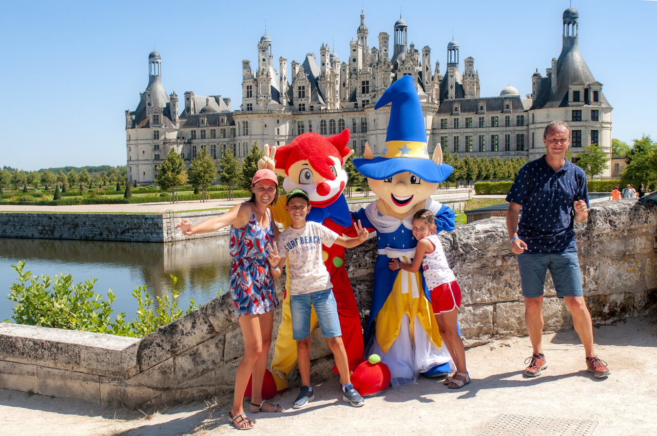 Family and mascots in front of Chambord Castle, near Su�vres (41).