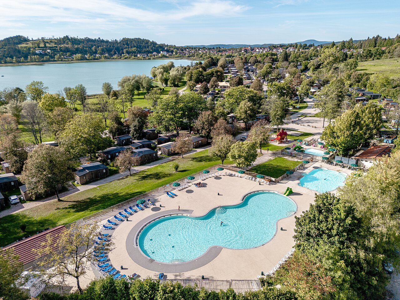 Aerial view aquatic complex and accommodations at CLICOCHIC Grisi�re campsite Clairvaux-les-Lacs (39).