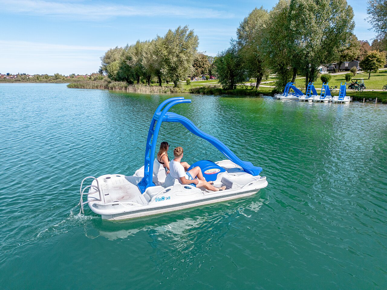Pedal boat slide on the lake at camping CLICOCHIC Grisi�re in Clairvaux-les-Lacs (39).