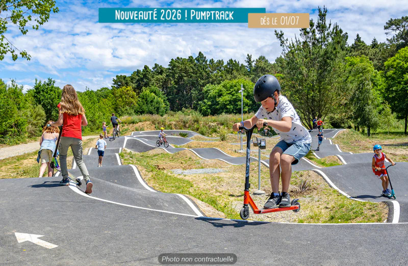 Modern pumptrack for scooters and bikes, active children at VAGUES OCEANES Hamacs � Fleury (11) campsite.