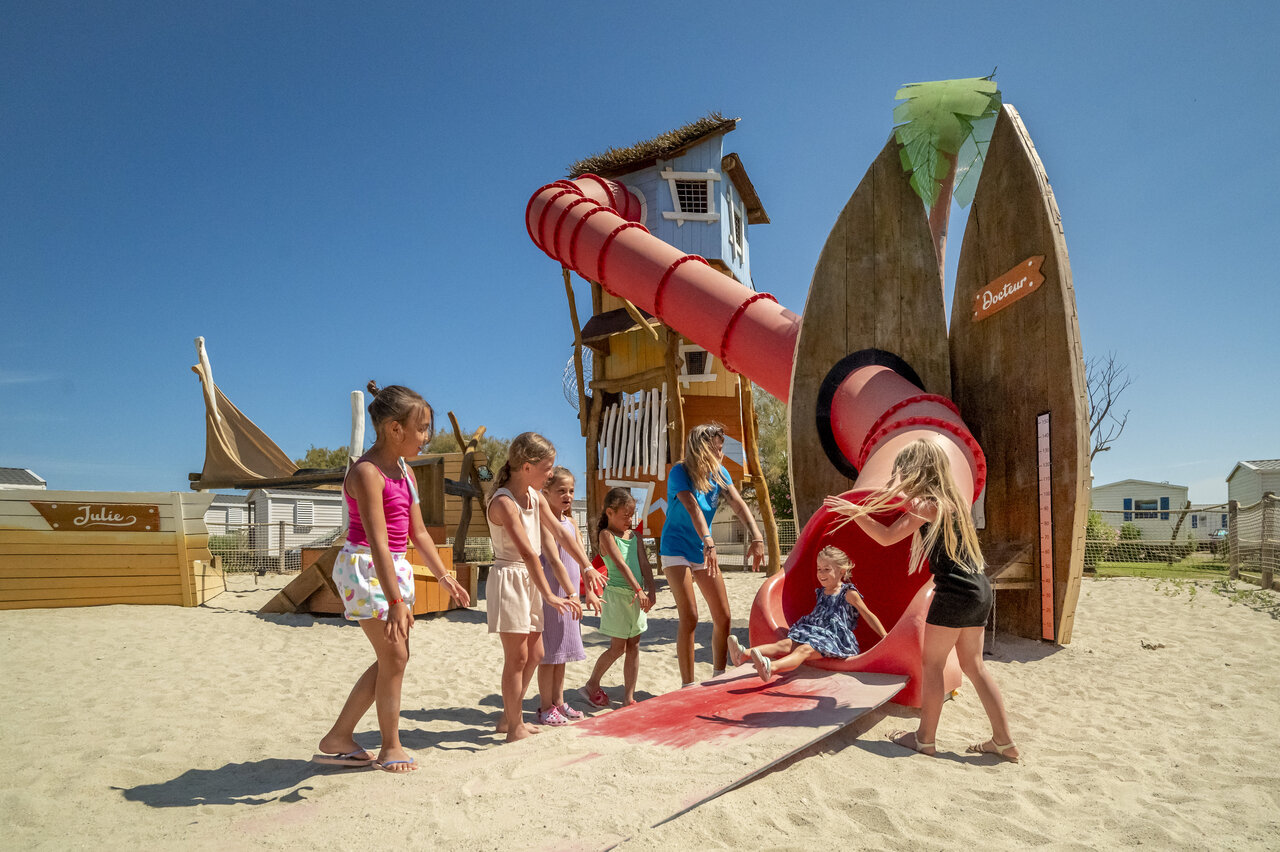 Giant slide, sandy playground at VAGUES OCEANES Hamacs Fleury (11) campsite.