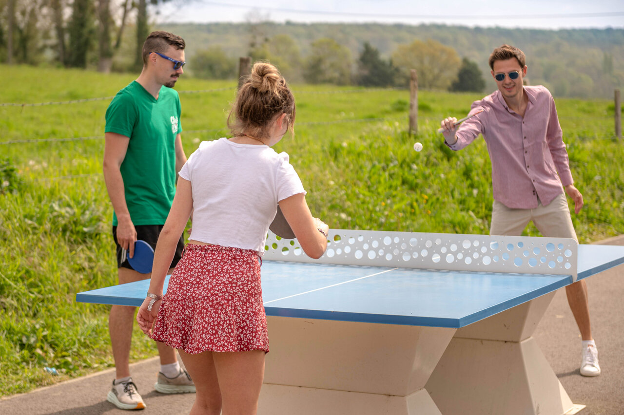 Outdoor table tennis for three people at CLICOCHIC Haras de Deauville campsite.