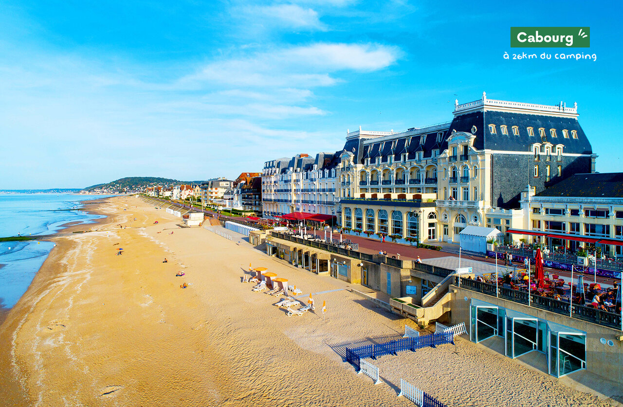 Long sandy beach and elegant buildings of Cabourg, a town to visit.