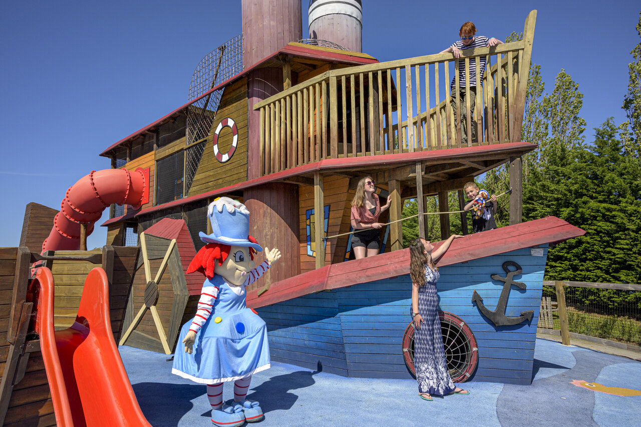 Pirate ship playground, slide and mascot at CAPFUN Hautes Coutures campsite in BENOUVILLE (14).