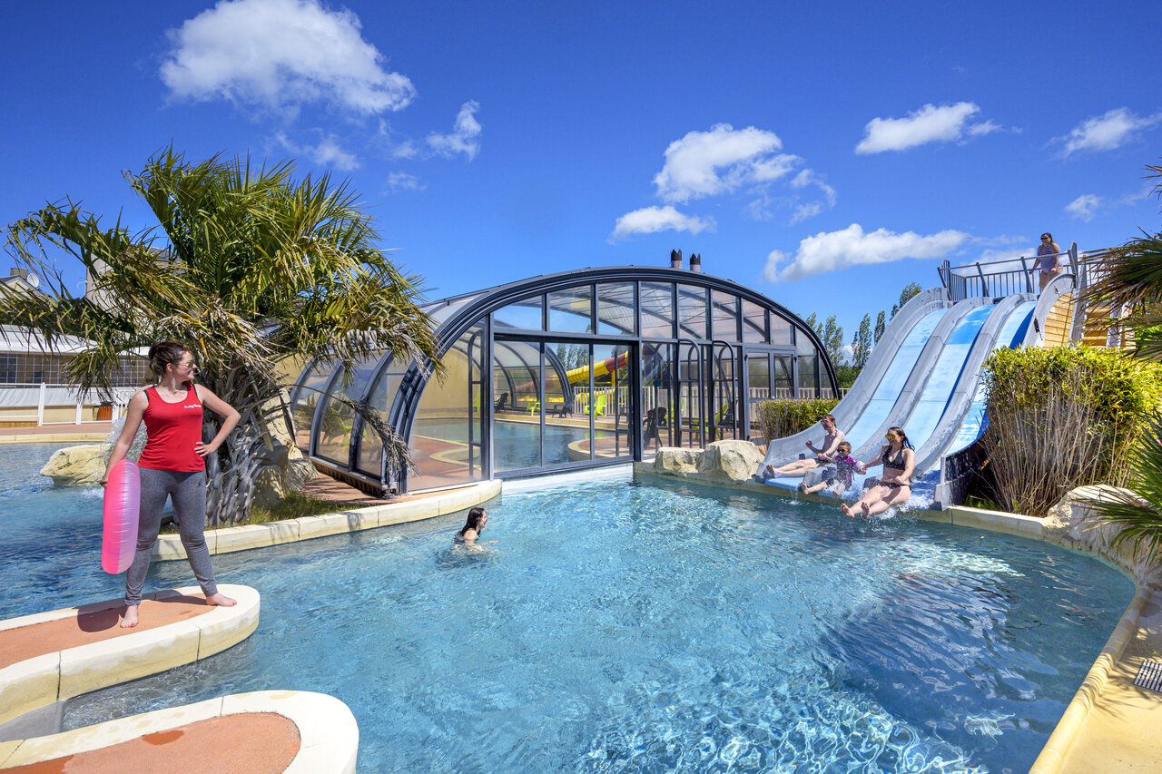 Water slides, outdoor and indoor pool at CAPFUN Hautes Coutures campsite in BENOUVILLE (14).