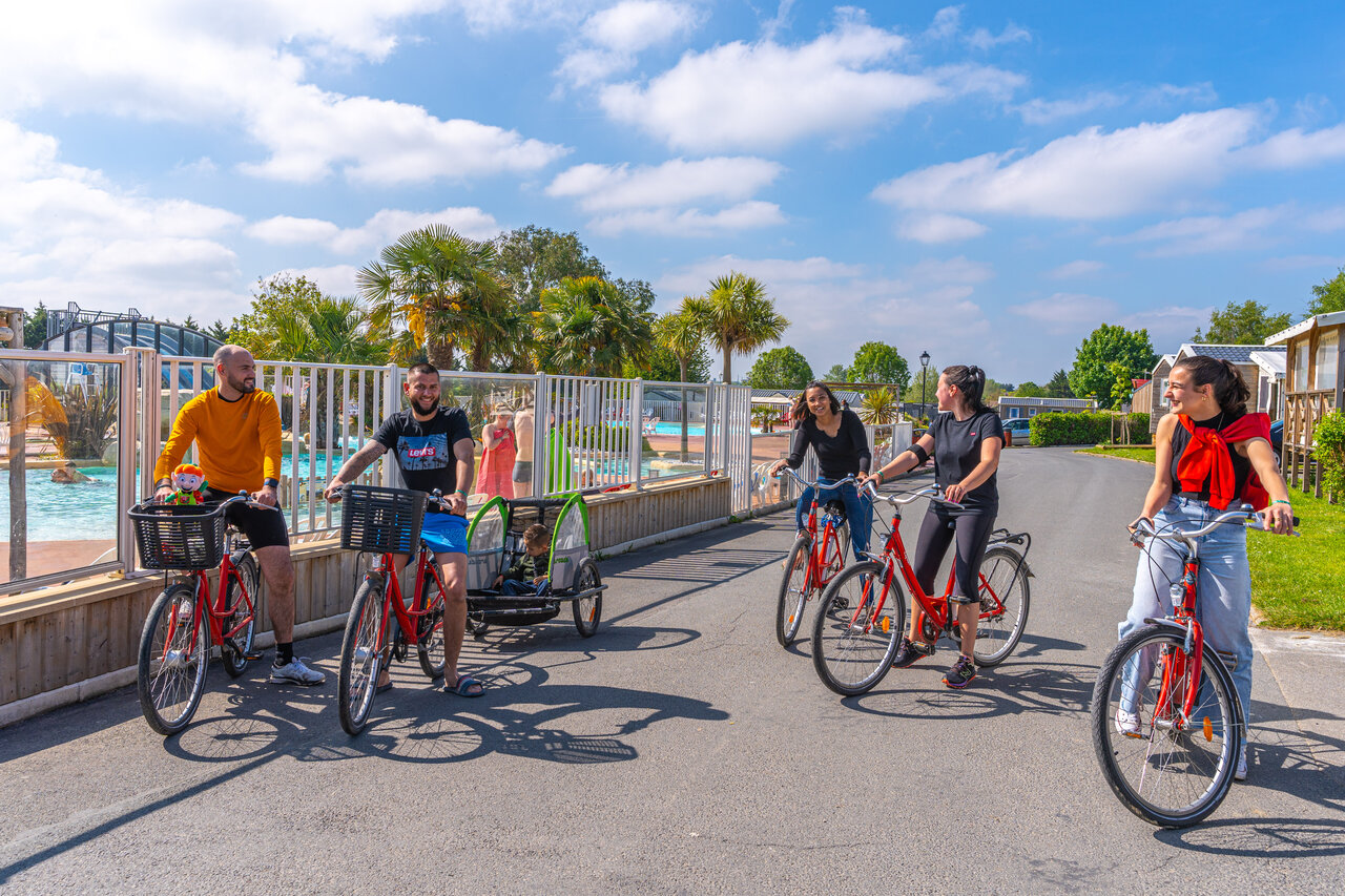 Cyclists, pool, at CAPFUN Hautes Coutures campsite in BENOUVILLE (14).
