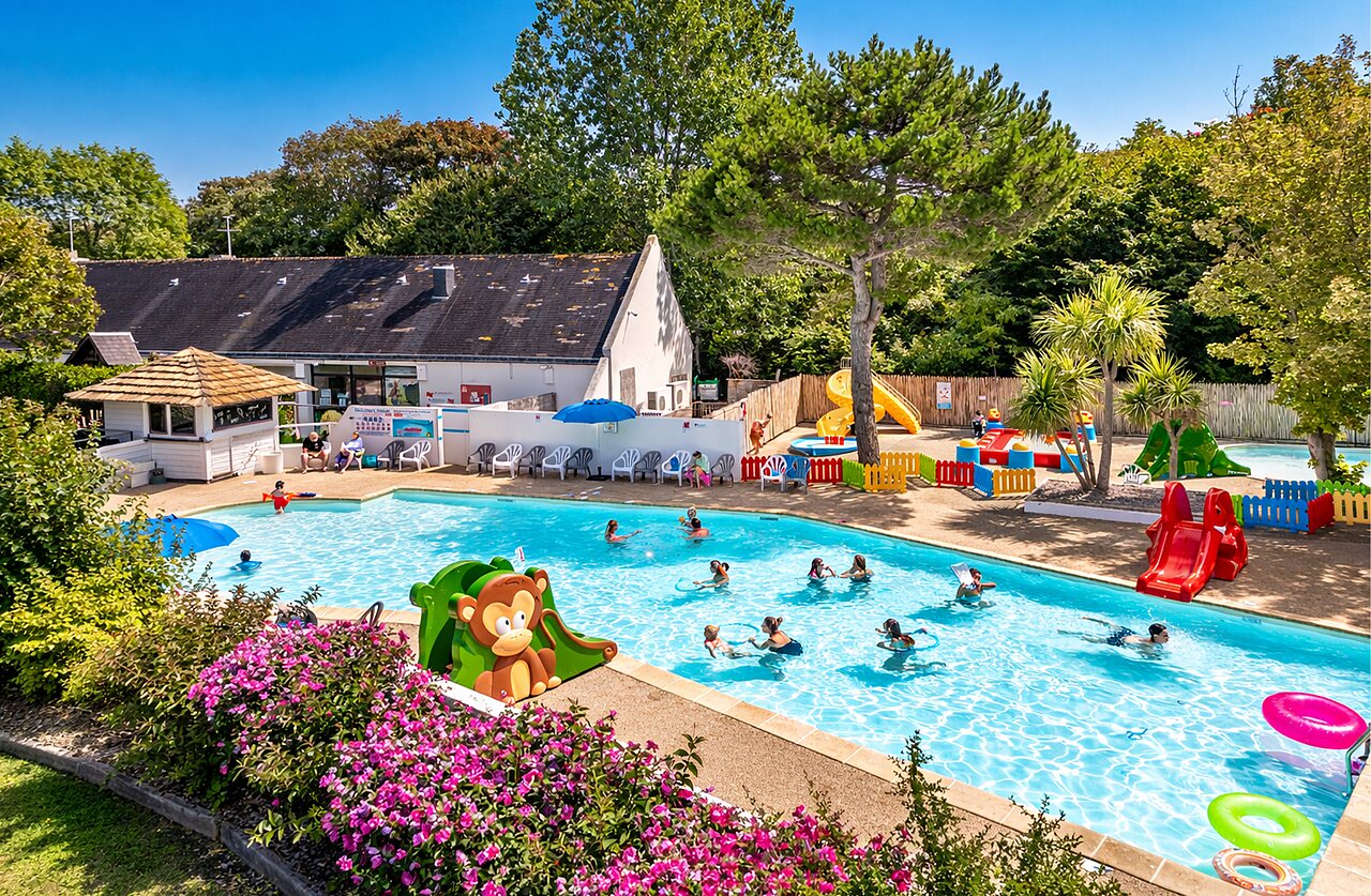 Outdoor pool, slides and water games at CLICOCHIC Havre de Berni�res campsite.