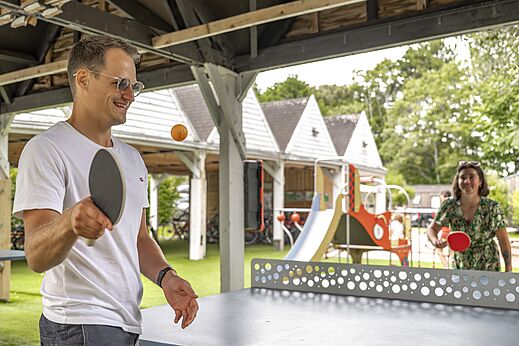 Outdoor table tennis game at CLICOCHIC Havre de Berni�res campsite.