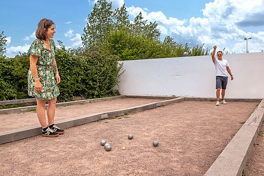 Petanque court with players at CLICOCHIC Havre de Berni�res campsite (14).