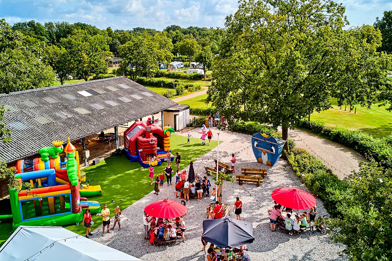 Colorful bouncy castles and lively play area at CAPFUN Heino campsite in Heino.