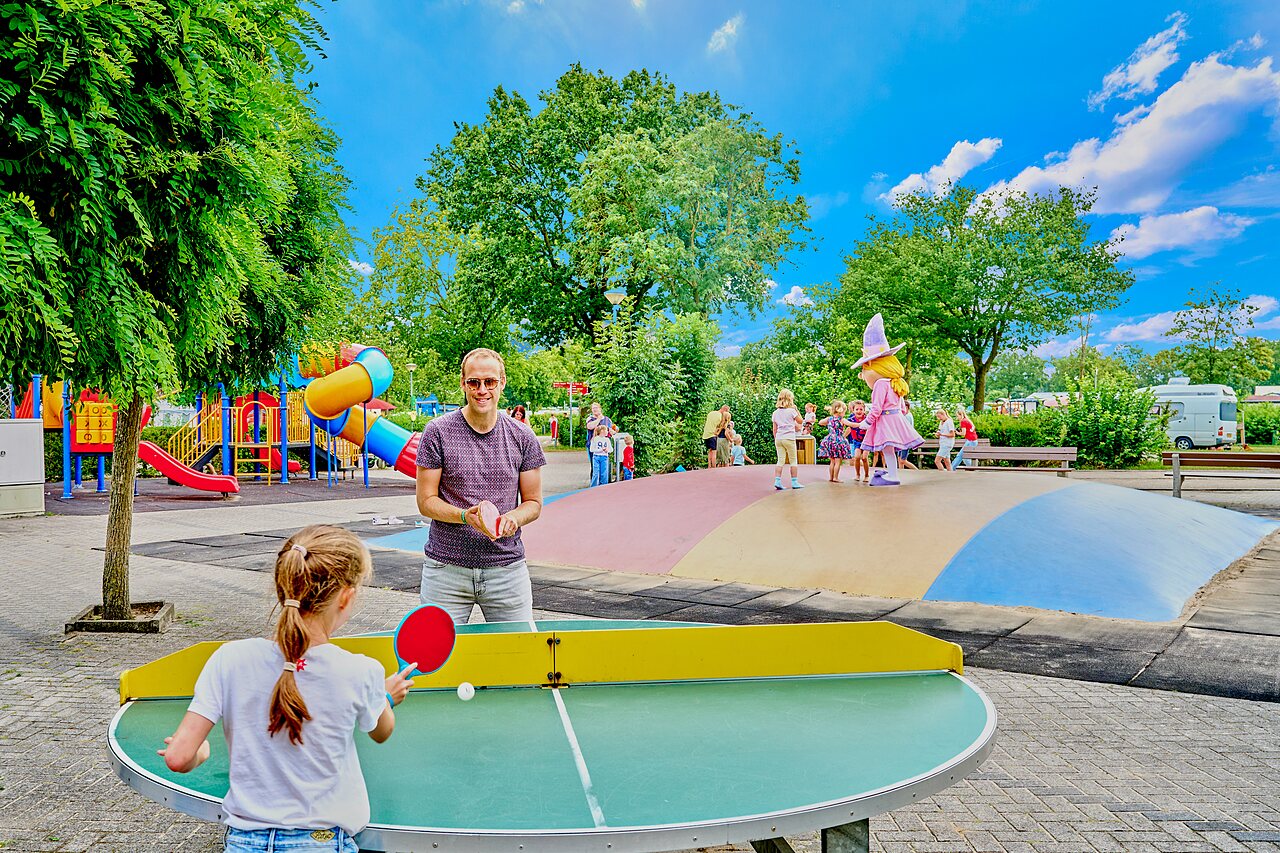 Table tennis, playground and inflatable structure at CAPFUN Heino campsite.