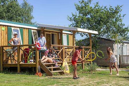Family enjoying Mobile home at CAPFUN Heino campsite in Heino.