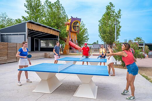 Outdoor ping-pong tables and playground at CAPFUN Hermitage campsite in SERIGNAN (34).