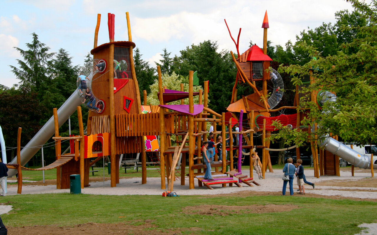 Wooden playground, slides, climbing towers at CAPFUN Hirondelle campsite in Oteppe.