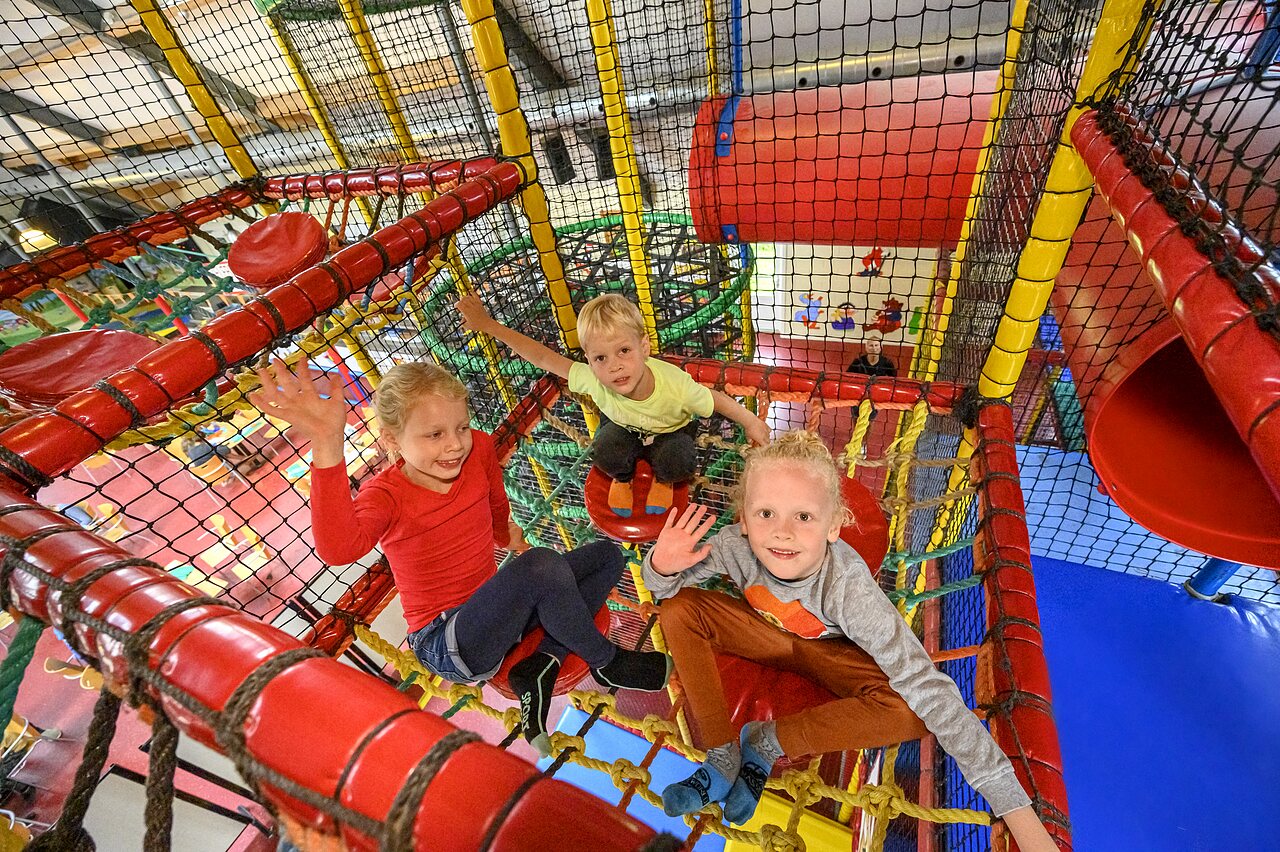 Children having fun in the indoor play area at CAPFUN IJsselstrand campsite in Doesburg.
